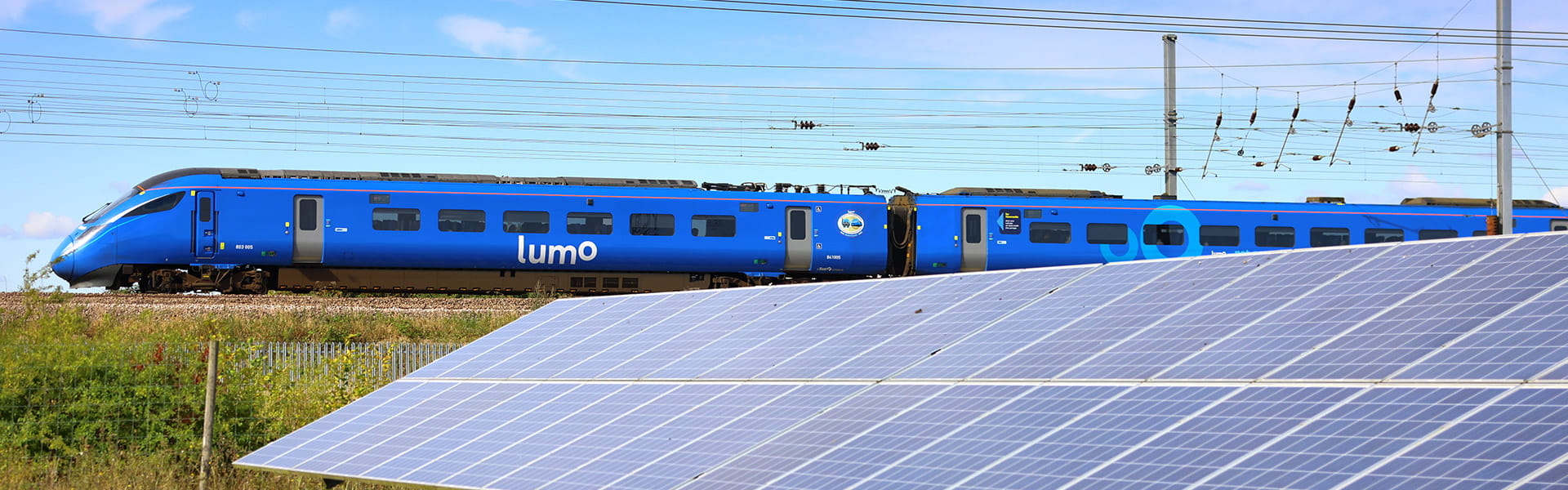 Lumo train next to solar pannels