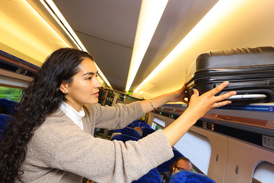 Customer storing small suitcase