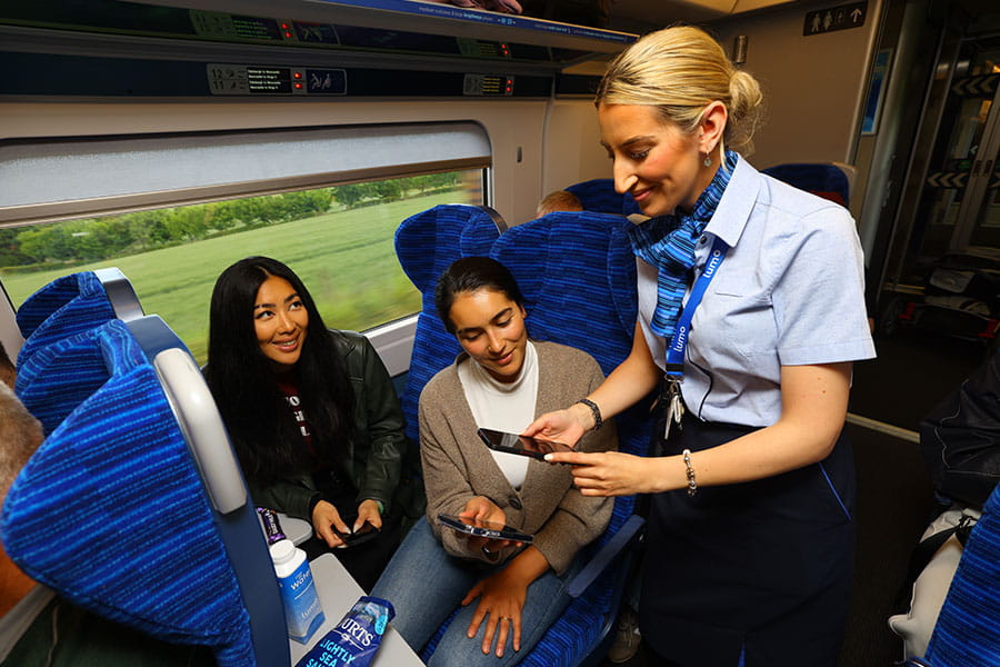Lumo staff checking passenger tickets