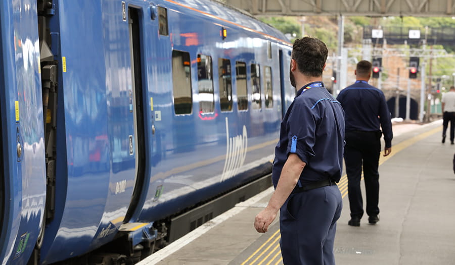 Ambassador standing in front of a Lumo train