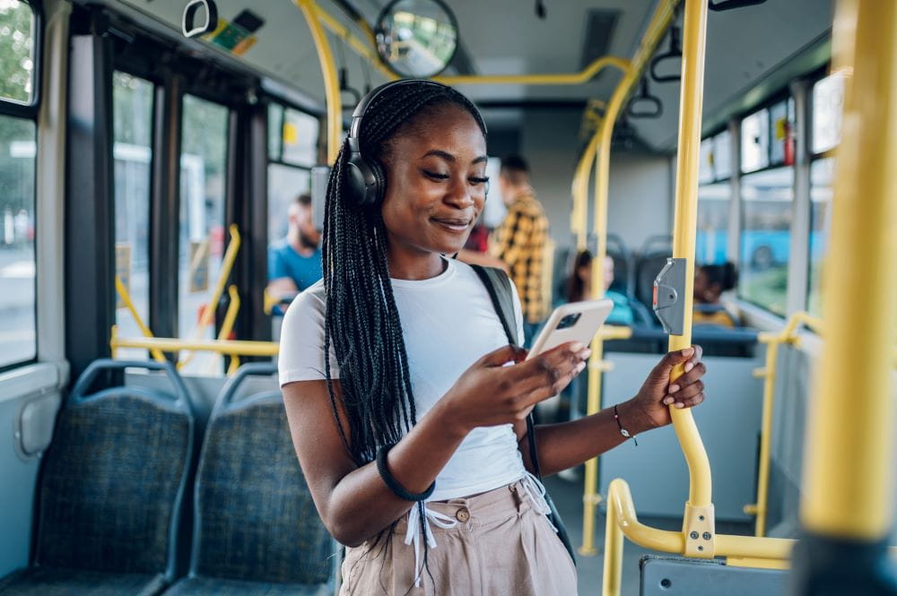 woman listening to music on a bus