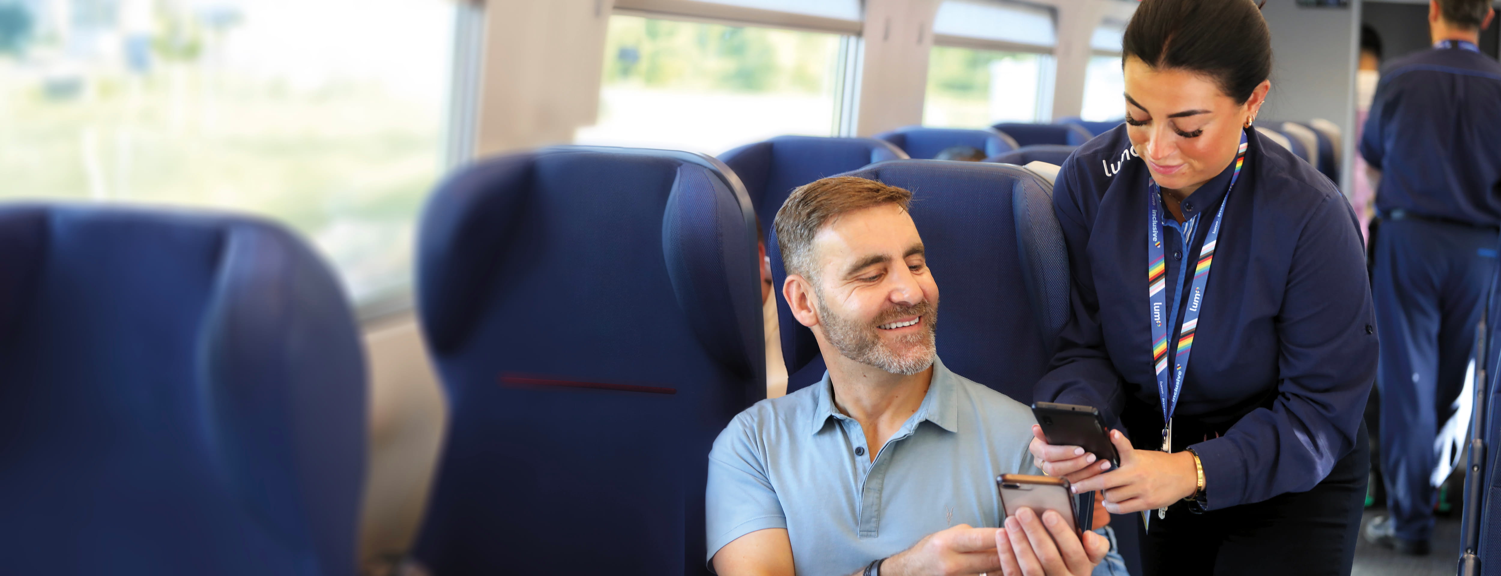 lumo staff scanning train e-ticket