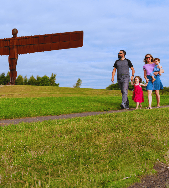 family walking in a field
