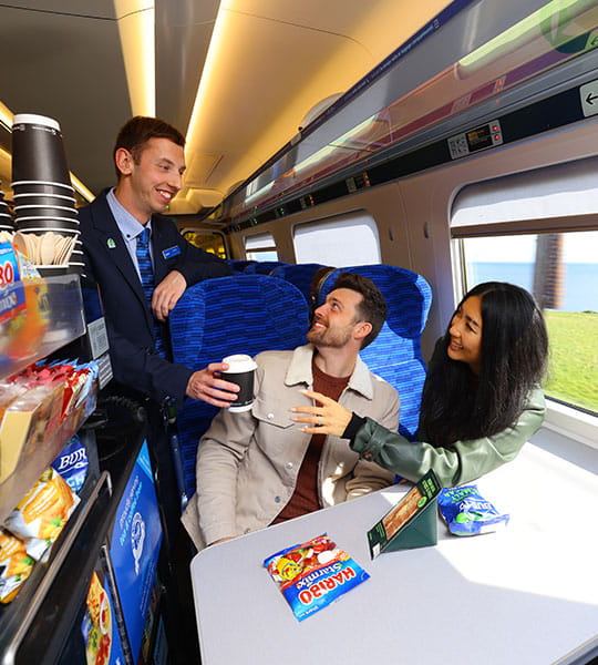 Lumo staff serving customers with catering trolley