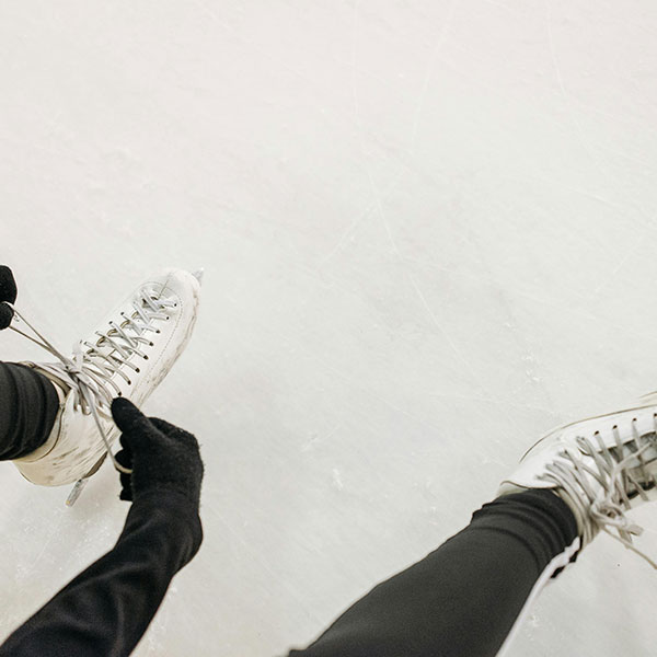 Person tying up ice skates