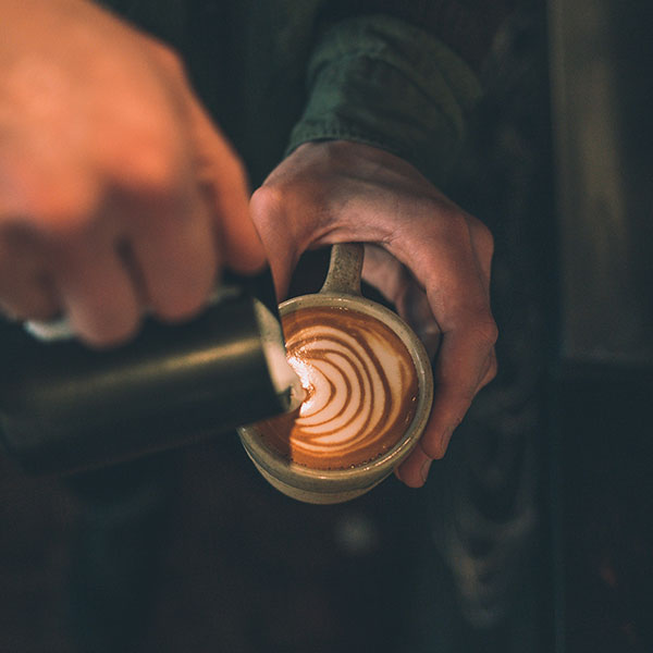 Barista making latte art