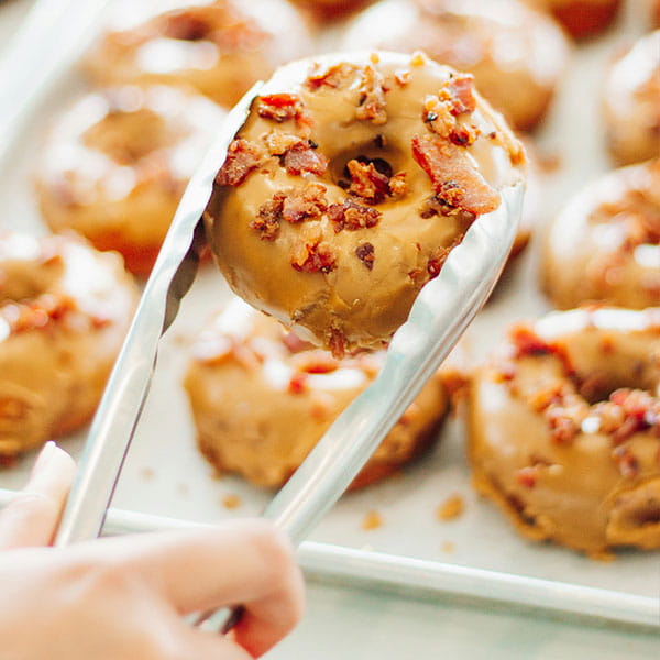 Glazed doughnuts displayed on a tray