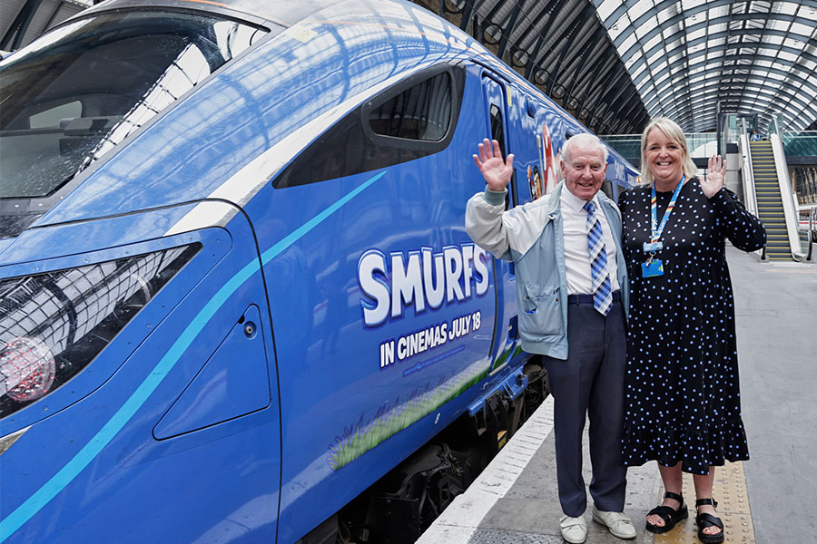 Charlie Barker and Lumo's Customer Experience Manager, Rachel Firth, next to a Lumo train