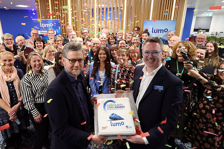 Lumo and Community Rail Awards representatives in a reception