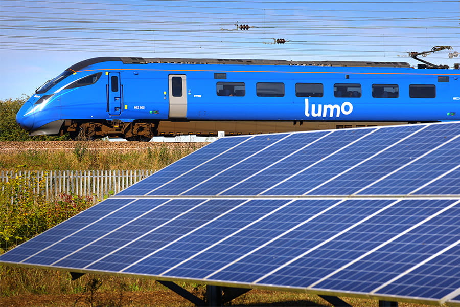 Lumo train next to a solar panel