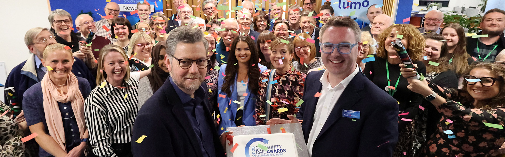 Lumo and Community Rail Awards representatives in a reception
