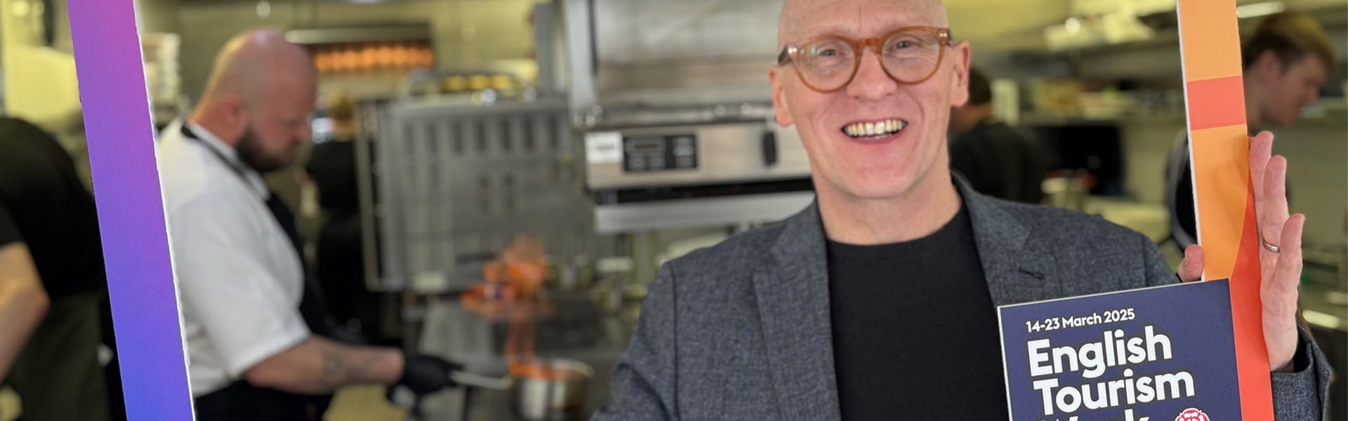 Alfie Joey, broadcast and event host, holding an English Tourism Week sign