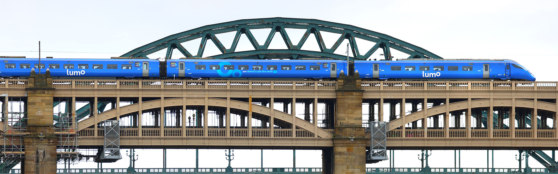 Lumo train going through Tyne bridge