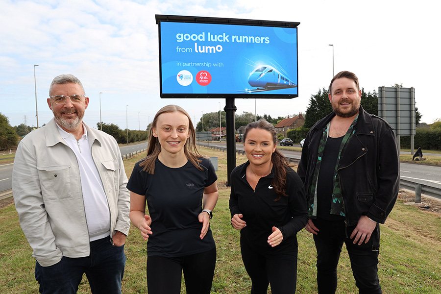 Mark Clancey from Smart Media Group with Lumo runners Beth Forbister and Lucy Harper alongside Stuart Angus from Side by Side Arts