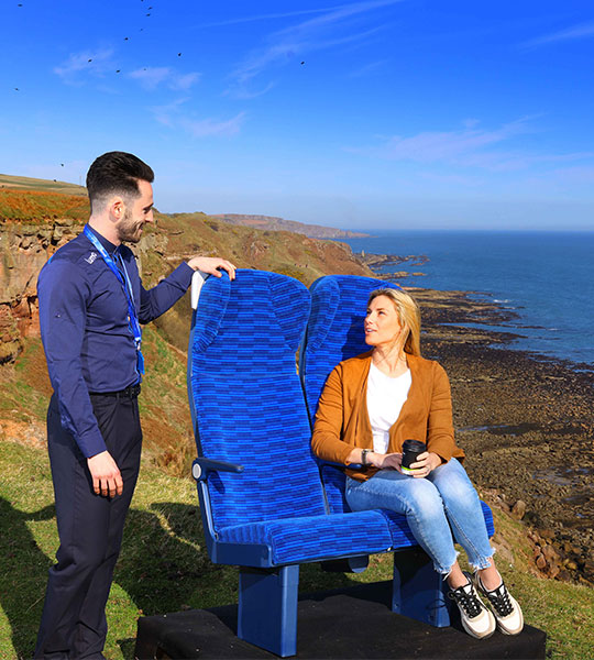 Lumo ambassador next to a customer sitting in new seats