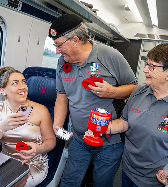 Man selling poppies onboard