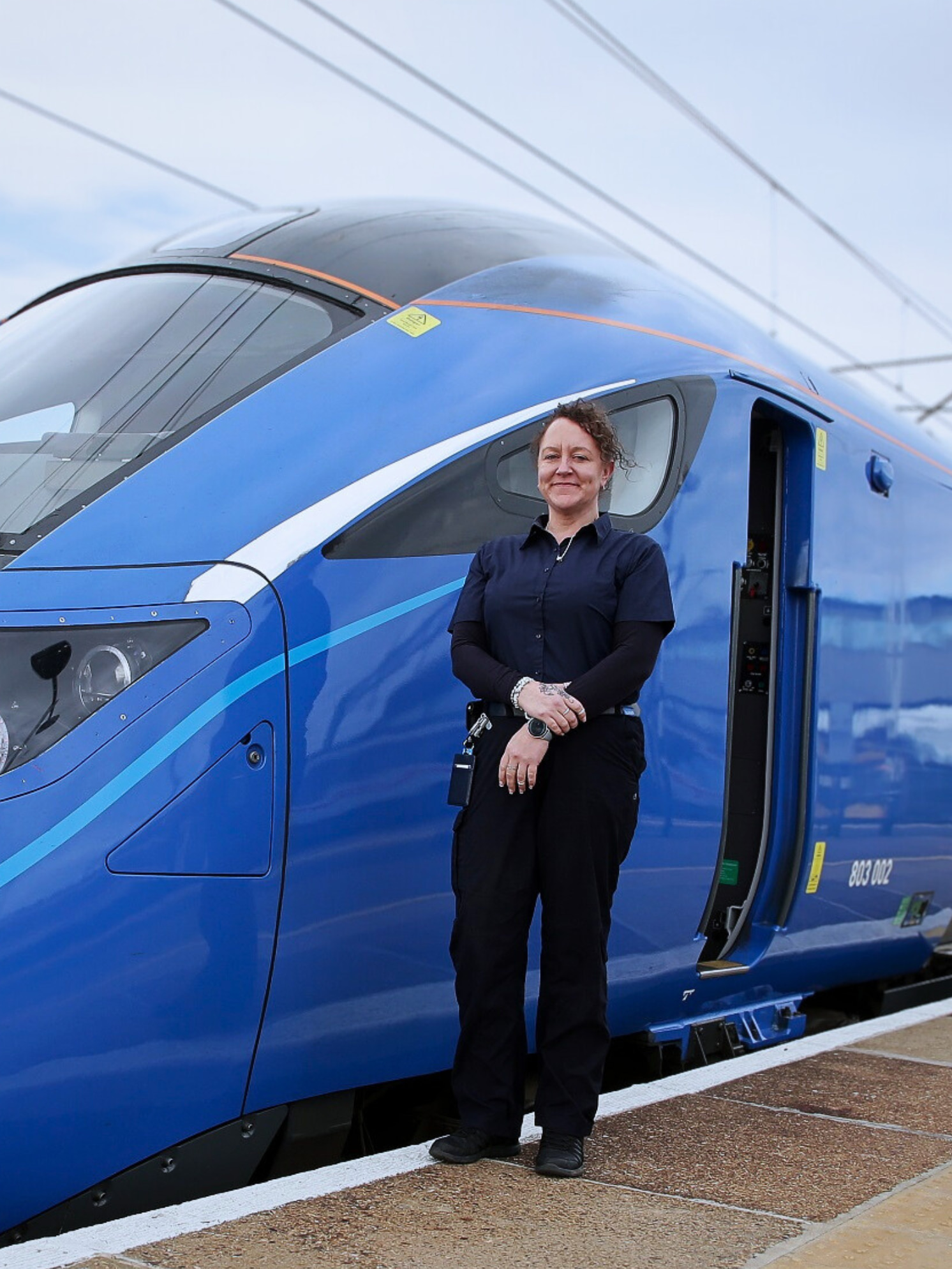 train driver outside of lumo train