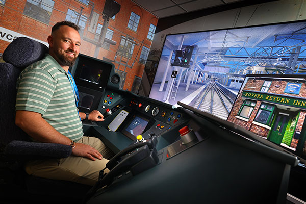 Anthony Kidd in the train driver training cab