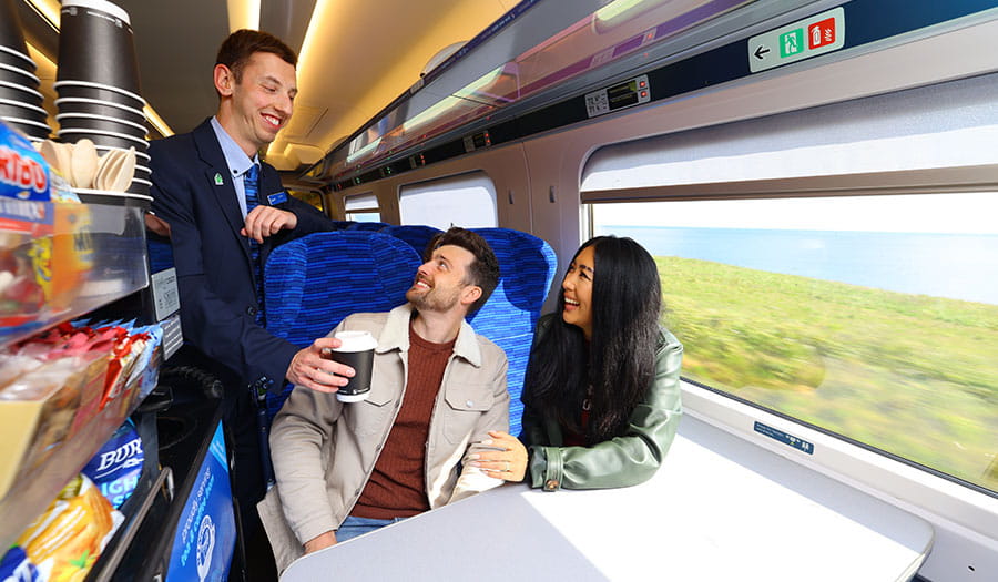 Lumo staff handing coffee to customers