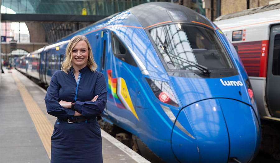 Train driver next to a Lumo train